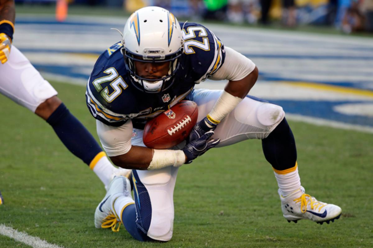 Darrell Stuckey, with a WHOOP device under the tape on his right wrist, recovers a fumble during the second half against the Dolphins last November.